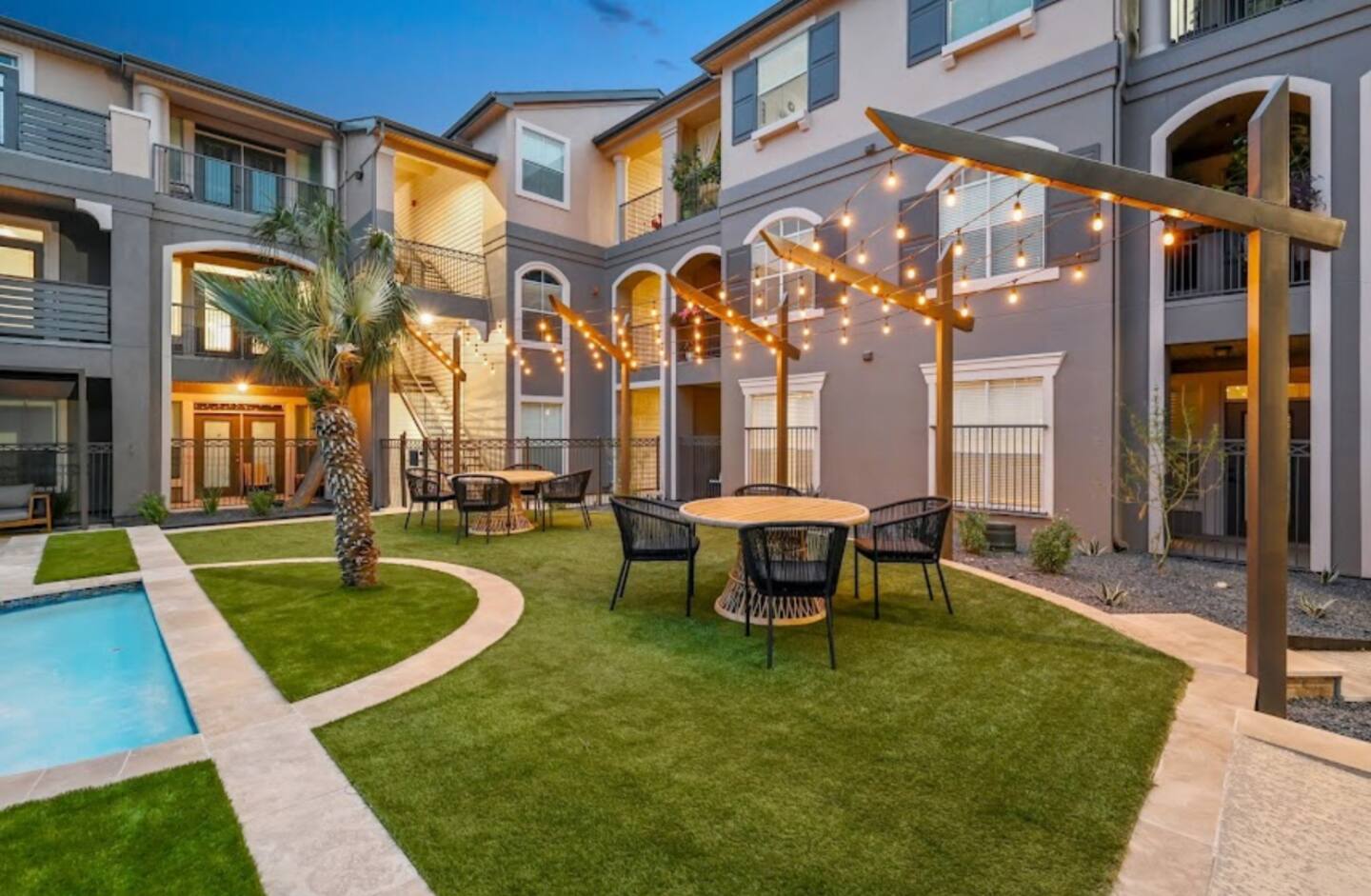 Courtyard with string lights in the evening