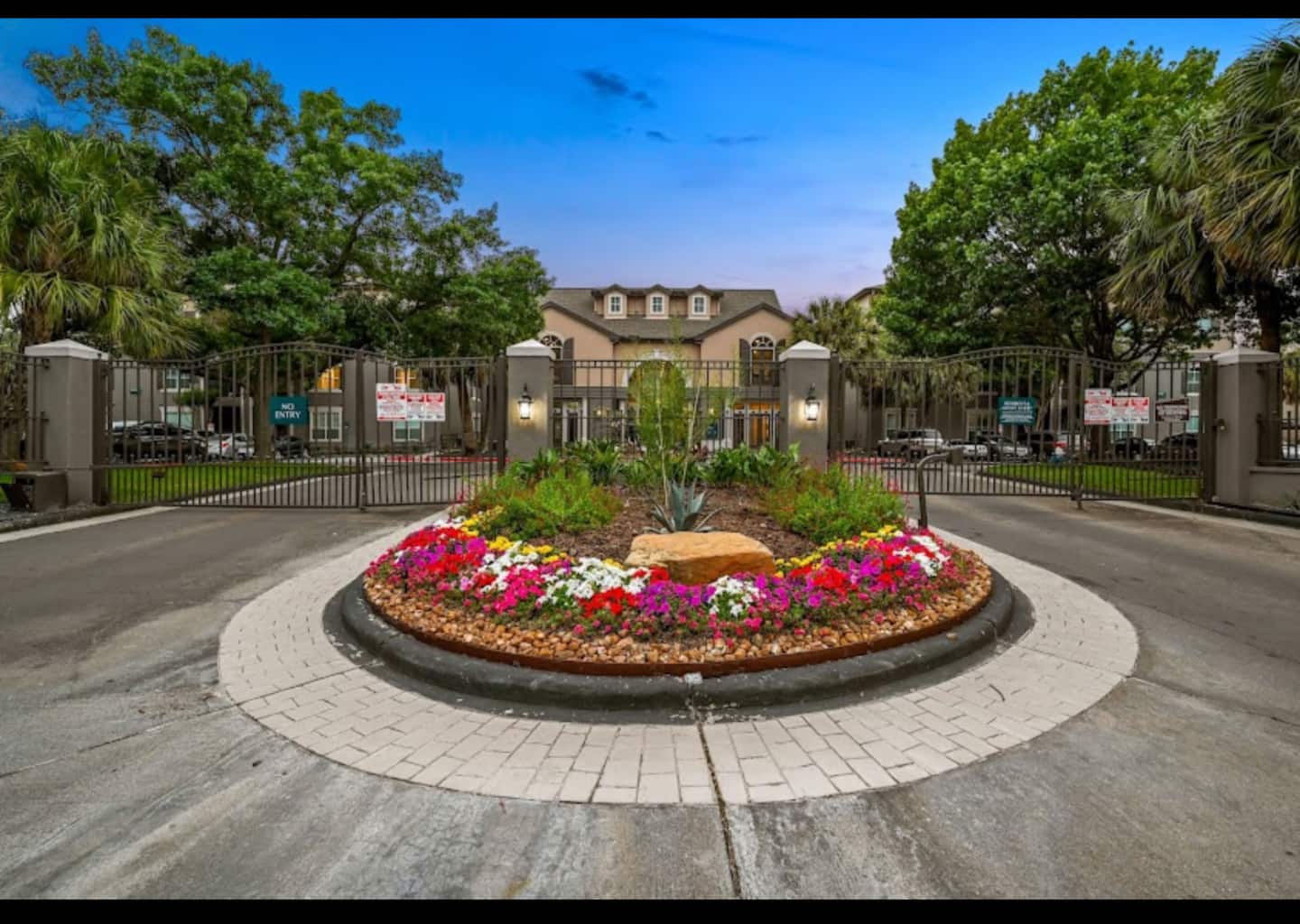 Gated entrance with landscaped garden